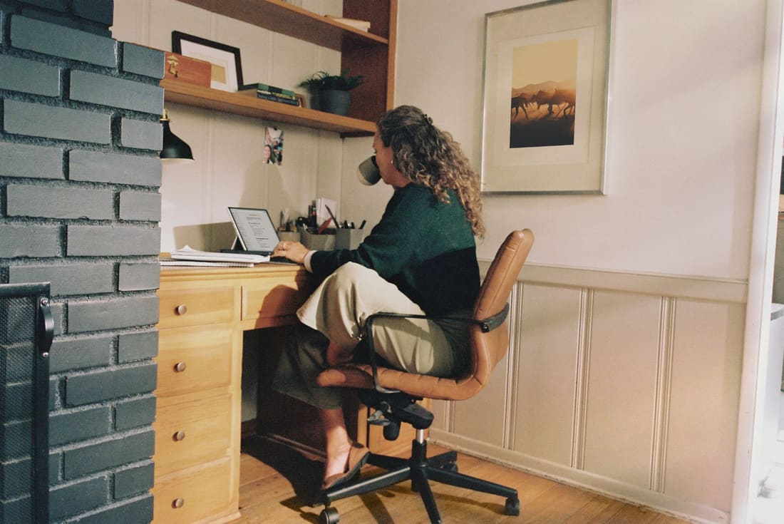 Self-employed worker at her home office desk